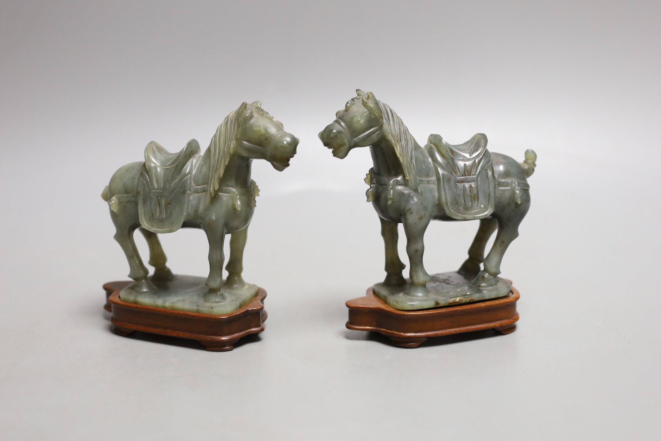 A pair of 20th century Chinese celadon jade figures of horses - 12cm tall